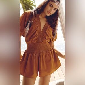 Anthropologie Mustard Smocked Open Tie Back Romper